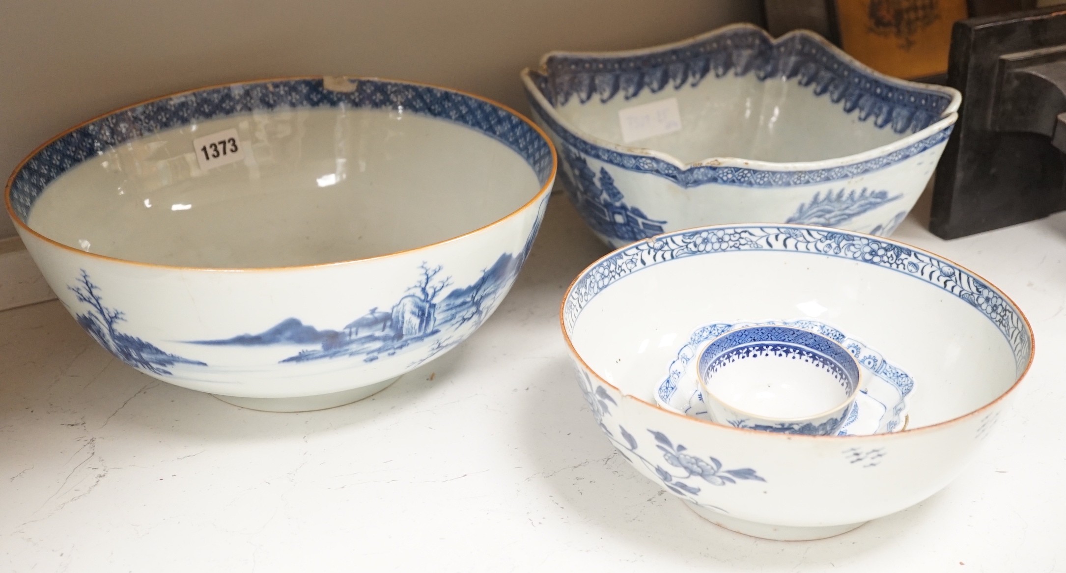 A selection of 18th century blue and white Chinese export bowls and dishes, largest 31cm diameter